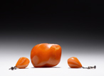 A SET OF THREE NATURALISTIC AMBER JEWELERY