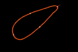 A STRAND OF PRAYERS BEADS CONSISTING OF 108 CORAL AND AMBER BEADS