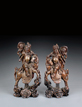 A PAIR OF WOODEN GUANYU ON HORSE CARVINGS INSET WITH SILVER LINES