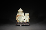 A WHITE JADE 'PHOENIX' LINKED VASE