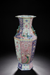 A LARGE CARVED FAMILLE ROSE HEXAGONAL VASE