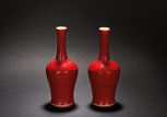 A PAIR OF RED GLAZED 'MALLET' VASES