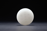 A WHITE JADE 'POEM' CIRCULAR PAPER WEIGHT