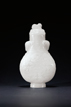 A WHITE JADE ARCHAISTIC DRAGON MOTIF VASE
