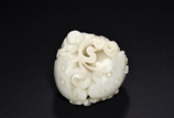 A WHITE JADE CARVED 'BOY AND LOTUS'
