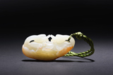 A WHITE JADE 'DOUBLE DUCK' PENDANT WITH SKIN