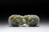 A CELADON JADE CARVED BELT BUCKLE