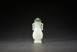 A WHITE JADE BOTTLE WITH SPINACH STOPPER