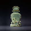 A SPINACH JADE OR JADEITE 'DEER AND PLUM' VASE