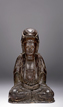 A PARCEL-GILT BRONZE FIGURE OF SEATED GUANYIN