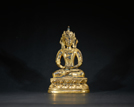 A GILT-BRONZE FIGURE OF AMITAYUS