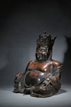A BRONZE FIGURE OF SEATED BUDAI