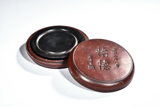 A CIRCULAR INKSTONE WITH CASE