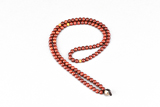 AN AMBER 'GOAT'S EYE' DZI BEAD NECKLACE