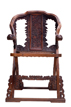 A HUANGHUALI OR HARDWOOD CARVED FOLDING CHAIR