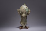 A BRONZE 'SANXINGDUI' HEAD