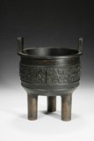 A BRONZE 'TAOTIE' TRIPOD CENSER '