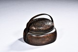 A BRONZE HANDWARMER