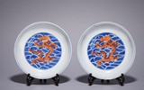A PAIR OF IRON RED BLUE AND WHITE DRAGON DISHES