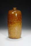 A BROWN GLAZED SLEEVE BOTTLE