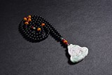 A JADEITE BEADED NECKLACE