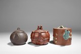 A SET OF THREE YIXING TEAPOTS