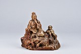 A SHOUSHAN STONE CARVED FIGURAL GROUP