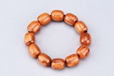 AN AMBER BRACELET OF TWELVE BEADS