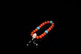 AN CORAL BEAD ROSARY BRACELET