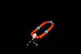 AN CORAL BEAD ROSARY BRACELET