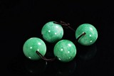 FOUR JADEITE BEADS