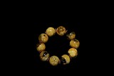 A MOTTLED YELLOW AMBER BRACELET