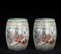 A PAIR OF FAMILLE ROSE 'FIGURES' STOOLS
