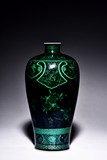 A BLACK GROUND GREEN ENAMELED 'POMEGRANATE VASE