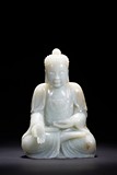 A WHITE JADE SEATED SHAKYAMUNI