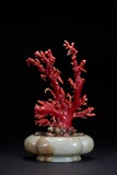 A WHITE JADE PLANTER WITH AKA RED CORAL