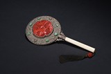 AN ANTIQUE CINNABAR LACQUER BONE HAND MIRROR