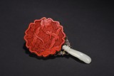 A CINNABAR LACQUER AND WHITE JADE HAND MIRROR