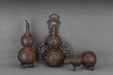 A SET OF THREE SILVER GEMS-INLAID DOUBLE GOURD