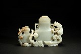 A GREENISH-WHITE JADE VASE GROUP