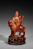 AN CARNELIAN AGATE CARVED FIGURAL GROUP