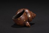 A GOLD-SPLASHED BRONZE CONCH SHELL CENSER