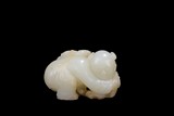 A WHITE JADE CARVING OF BOY AND LINGZHI