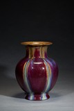 A FLAMBE GLAZED POMEGRANATE LOBED VASE 