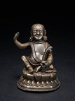 A SMALL SILVER FIGURE OF MILAREPA