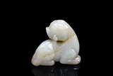 A WHITE JADE CARVED MYTHICAL BEAST