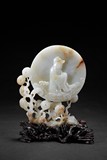 A SMALL WHITE JADE CIRCULAR 'GUANYIN' TABLE SCREEN 