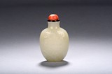 A WHITE JADE 'MAGPIE UPON PLUM' SNUFF BOTTLE