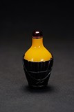 A YELLOW PEKING GLASS WITH BLACK OVERLAY BUCKET SNUFF BOTTLE