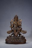 A PARCEL-GILT BRONZE FIGURE OF BIRD-RIDING BODHISATTVA